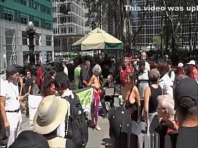 Topless women in street