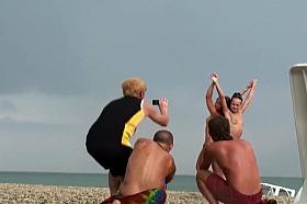 Nude girls pose for a photo and a voyeur