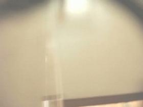 A fresh chick is taking off her tpo and remains topless in the dressing room