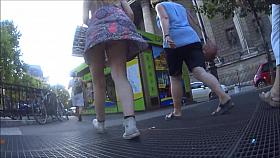 Young woman upksirt in the street