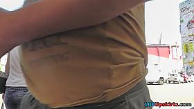 Upskirting video of auburn haired babe with a thong