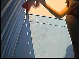 Hot bodied bikini girl spied in beach cabin by voyeur hunter