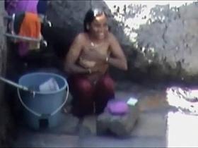 Tourist spied a poor woman washing up