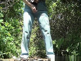 Mature woman caught in the woods pissing