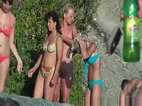 Nudist bathing by waterfall