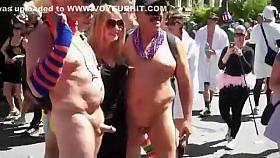 Two old exhibitionists take pictures with hot chicks while being naked