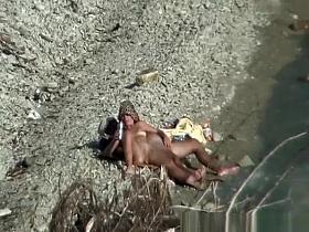 Two nudist couples spied at rocky beach