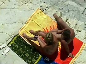 Horny blonde enjoys the beach