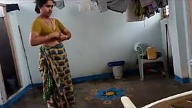 Indian wife with saggy tits puts on her clothes