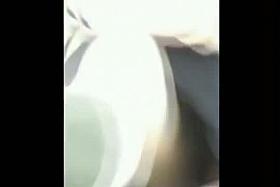 A voyeur filming upskirt videos in a crowded park