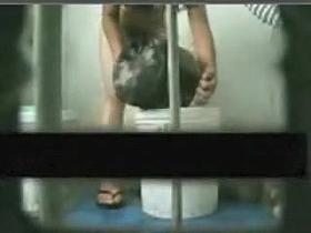 Poor girl washes up from a bucket