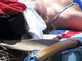 Hot brunette with nice body sunbathing