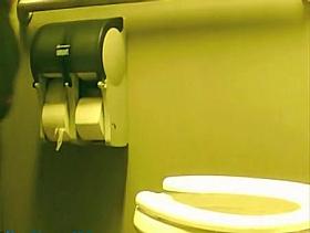 Girl sat pissing on toilet and flashed the booty view