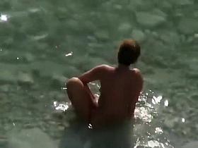 Spy a couple fuck on an isolated beach