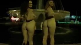 Naked night-time fountain play