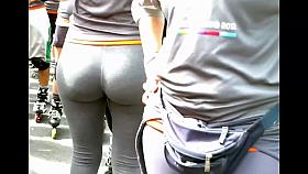 a woman in leggings with big round butt
