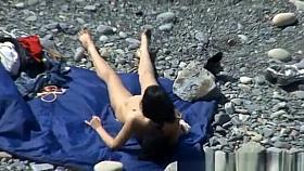 A man and his hot wife at the beach