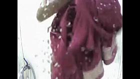 Tanned girl in beach shower