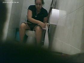 An older and chubby woman goes to a bathroom to piss and not to get filmed