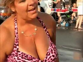 Mature woman playing beer pong
