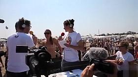 Lots of naked bodies at a nudist race