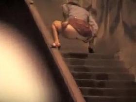 Pretty woman in a dress pisses in public