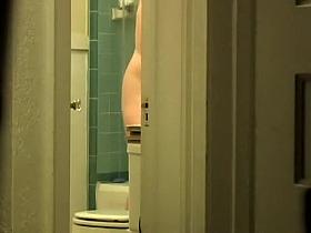 Hairy pussy peeks from the bathroom