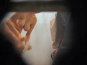 Nude busty amateur leans forward and shakes boobs