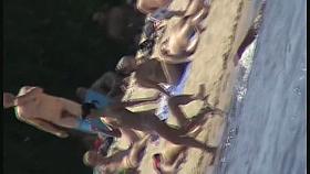 Cool babes with delicious tits taking sunbaths on a nude beach