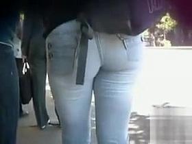 Beautiful young lady with a huge ass is wearing tight jeans