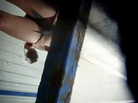 A girl takes off her top and gives a great upskirt view