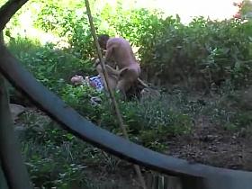 Mature couple fucking in public garden