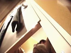 Woman in tan pantyhose sexy bent over in changing room