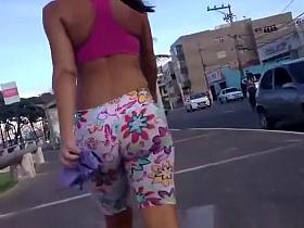 Brunette in spandex shorts walking