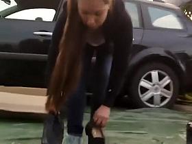 Sweet breasts of a girl bending down