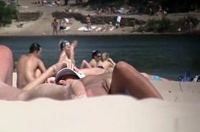 Brunette nudist woman sunbathing