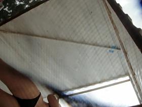 Voyeur cam under the beach cabin catching sexy butt details