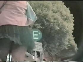 Perfect up skirt shot of black thong with help from the wind