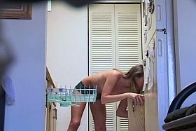 Blonde voyeured in the kitchen