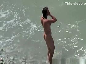 Small boobs nudist swimming in the water