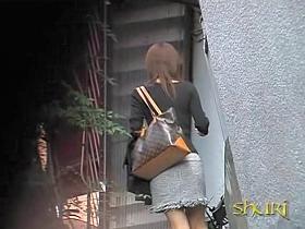 Open-minded pretty babe is walking on the street during fast sharking attack