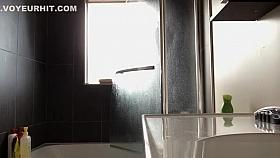 Tattooed chubby chick showering