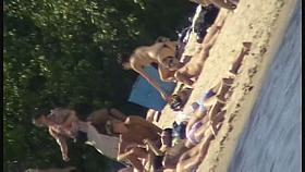 Cute brunette with black thong in the beach video