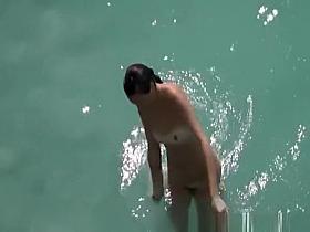 Nudist couple in the water