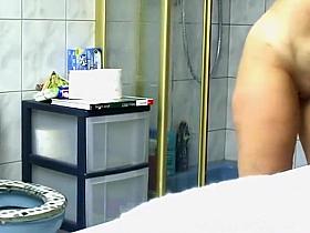 Mature woman spied in bathroom pissing and showering