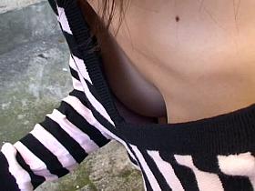 Asian cutie lets a voyeur see down her blouse