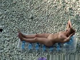 Woman arrives to the beach and undresses