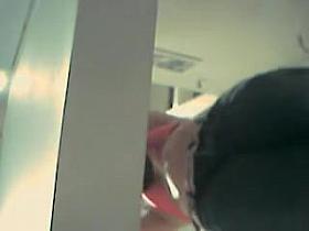 Amateur female in red lingerie bra on changing room cam