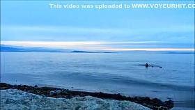 Naked woman greets the beauty of the sea