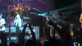 Attractive fan girl goes topless on the stage